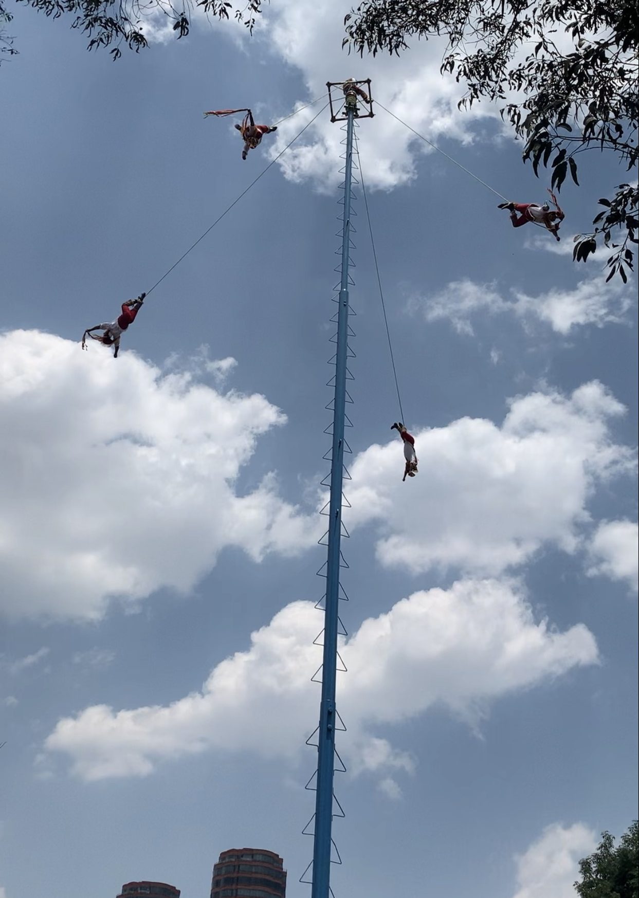 Performers swinging on rope of Voladores de Papalta – The meso-american ritual